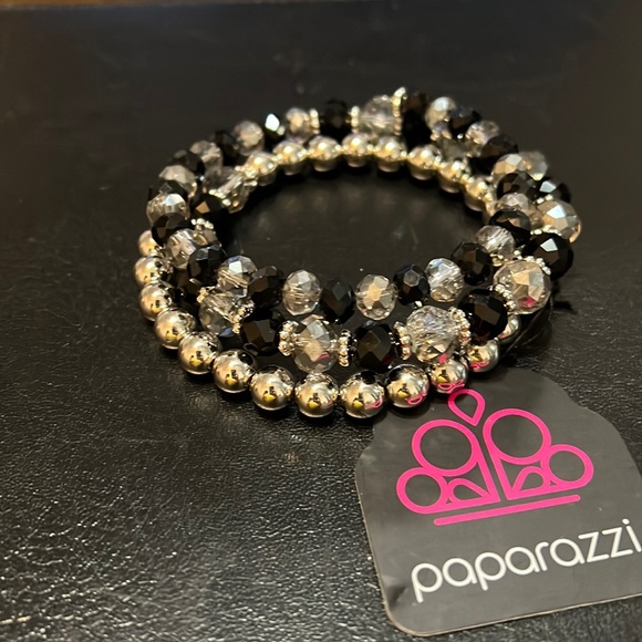 Spiral bracelet with clear and black beads with silver spacers